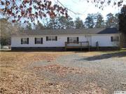 Convenient 4 bedroom 3 bath home in Matthews,  on almost a full acre.